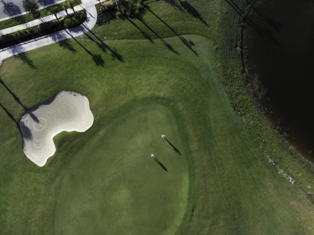 straight down shot of two glynlea golf members on the course