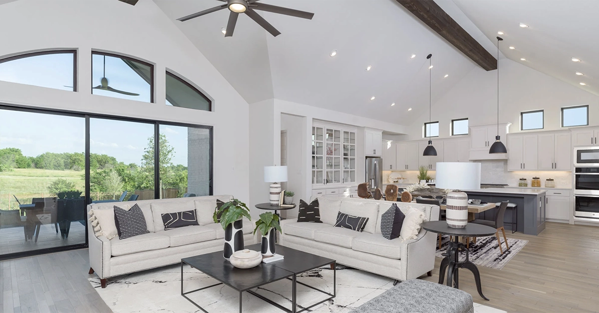 Bright model home living room at Glynlea Country Club with modern décor and open-concept design.