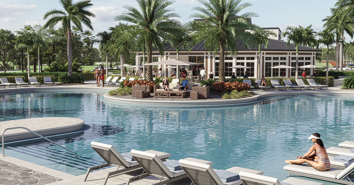 Resort-style pool area at Glynlea Country Club with lounge seating, palm trees, and a central gathering space.