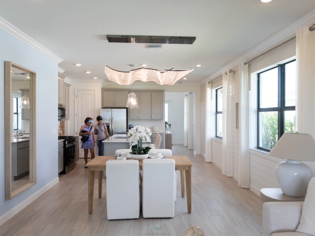 Modern kitchen and dining area with bright windows