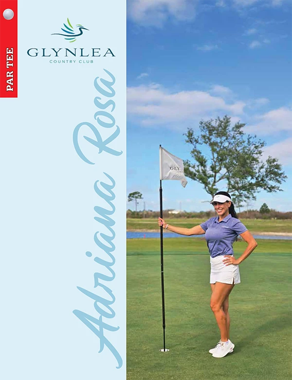 Woman holding golf flagstick on green at Glynlea Country Club under blue sky