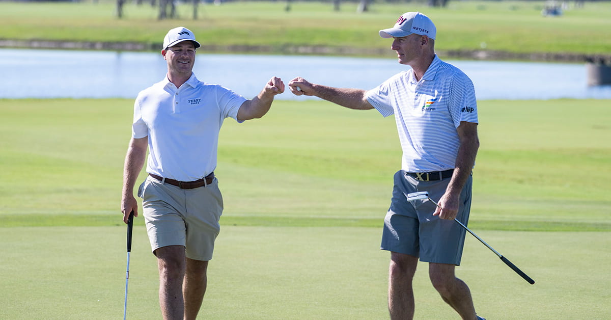 Golfers on Glynlea Golf Course fist bumping